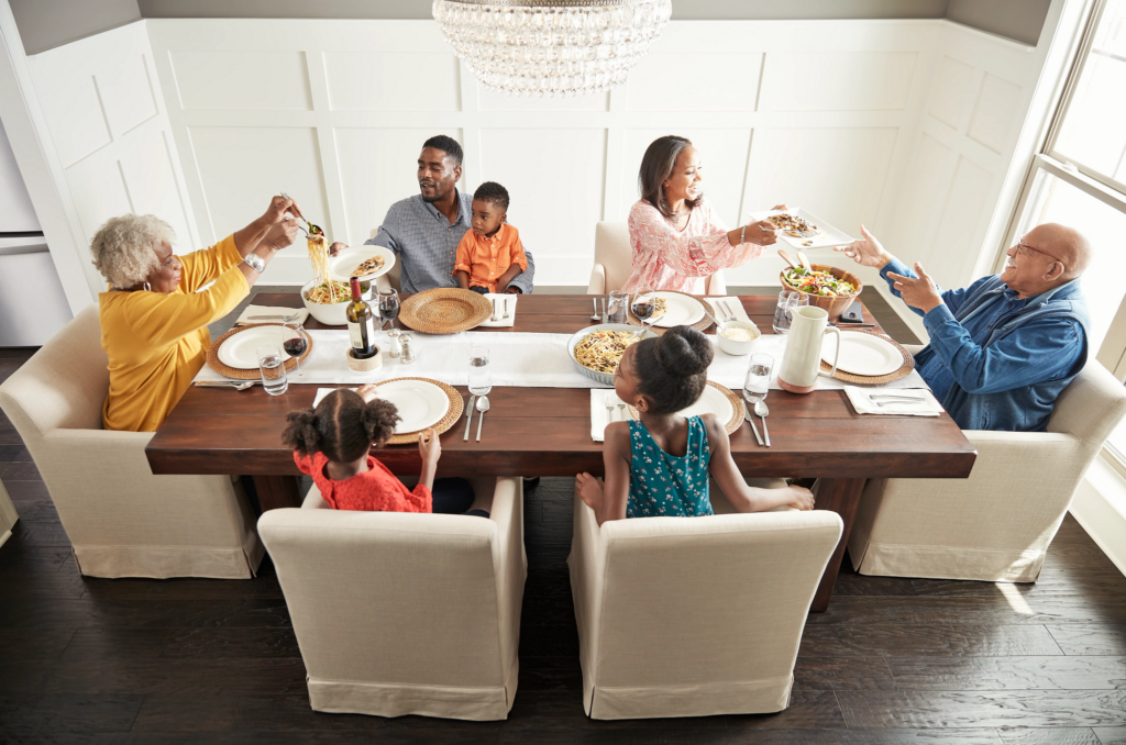 Happy family enjoying breakfast | Reinhold Flooring